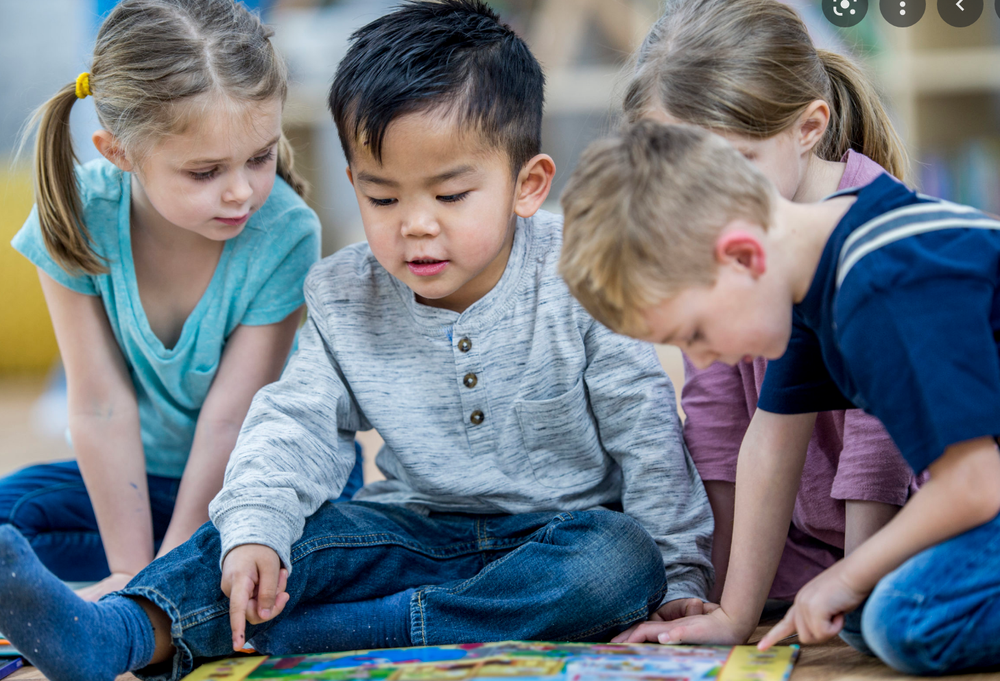 Children sitting together playing